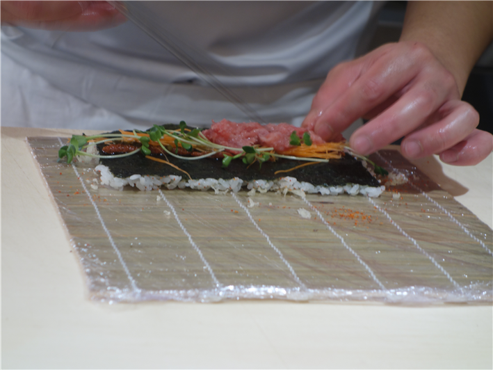 preparing sushi rolls
